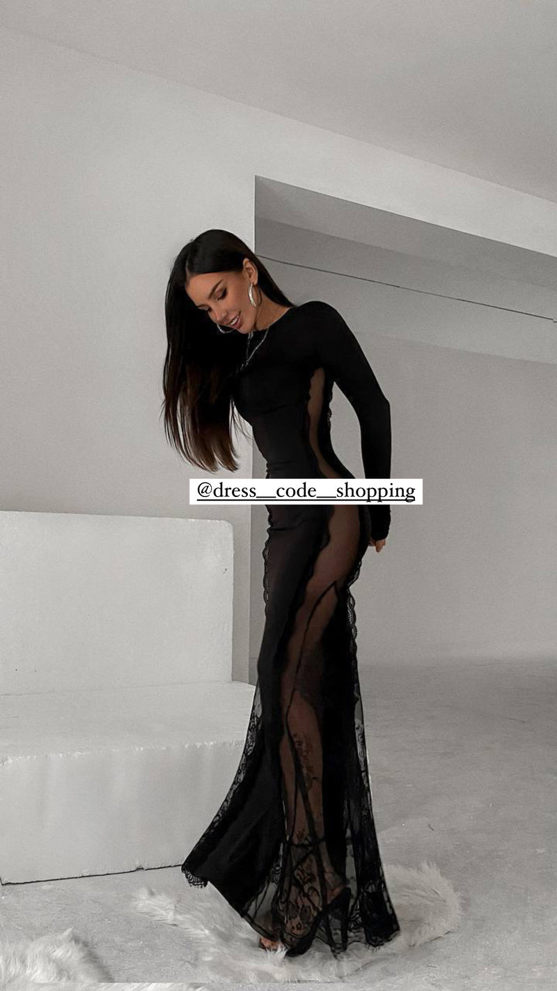 Andressa indossa un long dress nero nero aderente, caratterizzato da un design elegante e sensuale.
Presenta maniche lunghe e una scollatura rotonda.